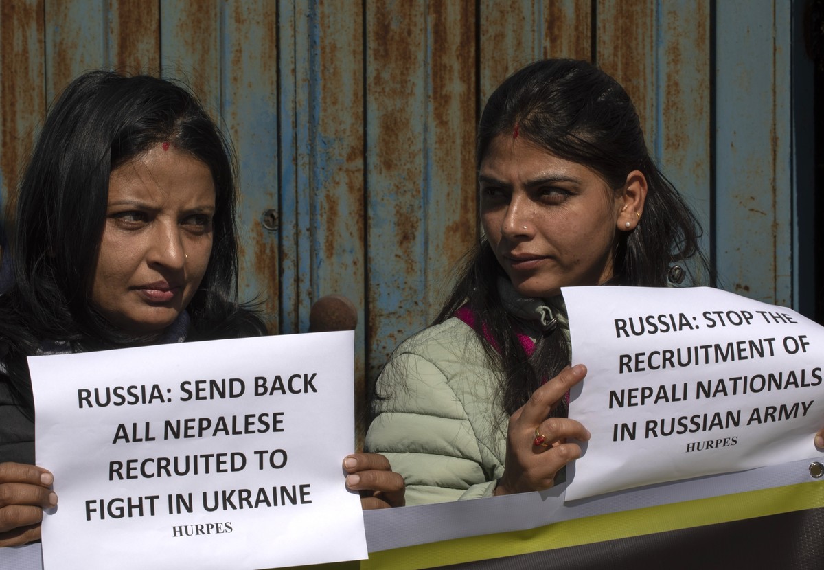 epa11128521 Activists affiliated with Human Rights and Peace Society Nepal hold placards during a protest in Kathmandu, Nepal, 05 February 2024. A group of activists staged a sit-in protest near the R ...