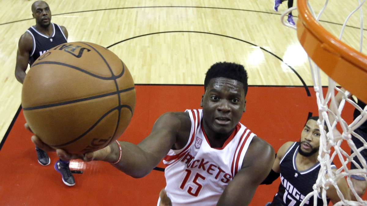 Houston Rockets' Clint Capela (15) shoots as Sacramento Kings' Garrett Temple (17) defends during the first half of an NBA basketball game Wednesday, Dec. 14, 2016, in Houston. (AP Photo/Dav ...