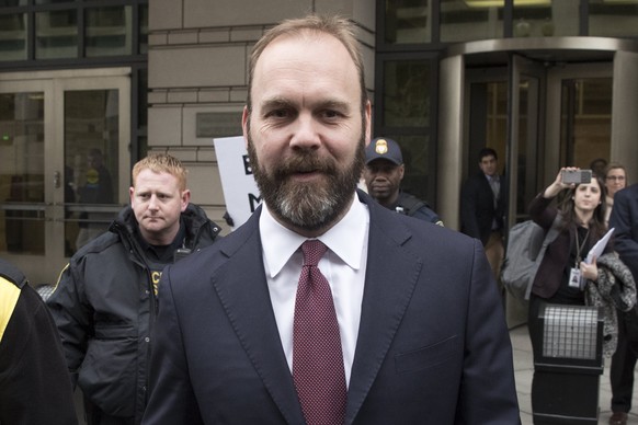 epa06558861 Former associate to former Trump campaign manager Paul Manafort, Rick Gates (C) departs the Federal Courthouse in Washington, DC, USA, 23 February 2018. Gates pleaded guilty to conspiracy  ...