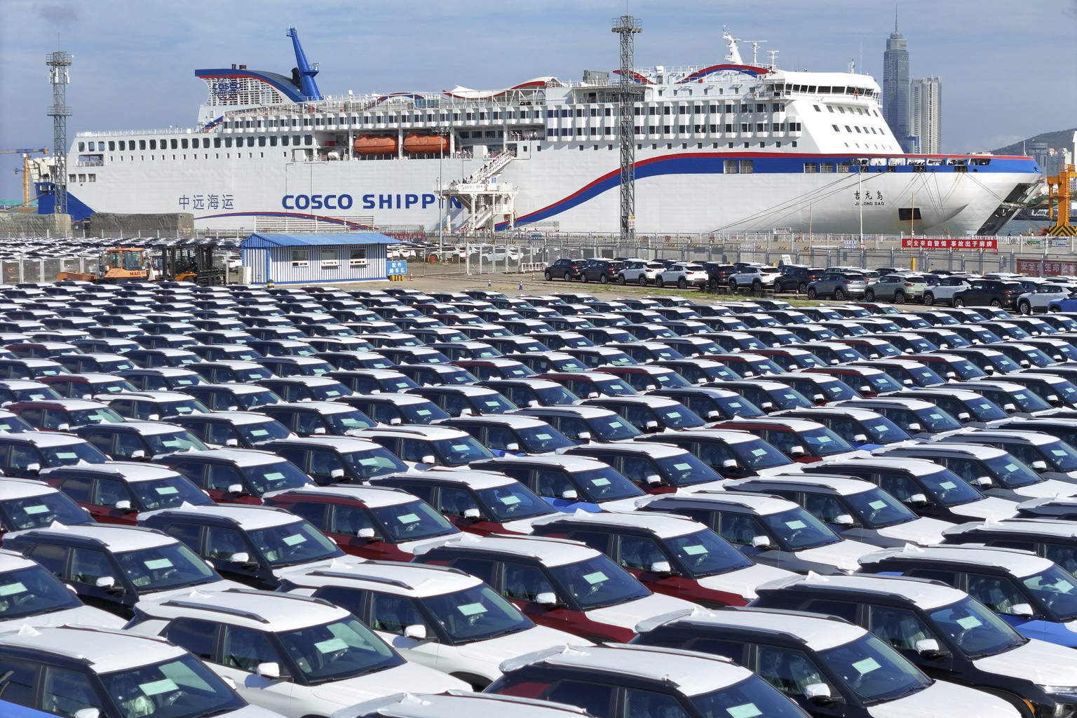 New cars wait to be transported on a dockyard in Yantai in eastern China&#039;s Shandong province on Sunday, Aug. 6, 2023. Customs data show China&#039;s exports plunged 14.5% in July compared with a  ...