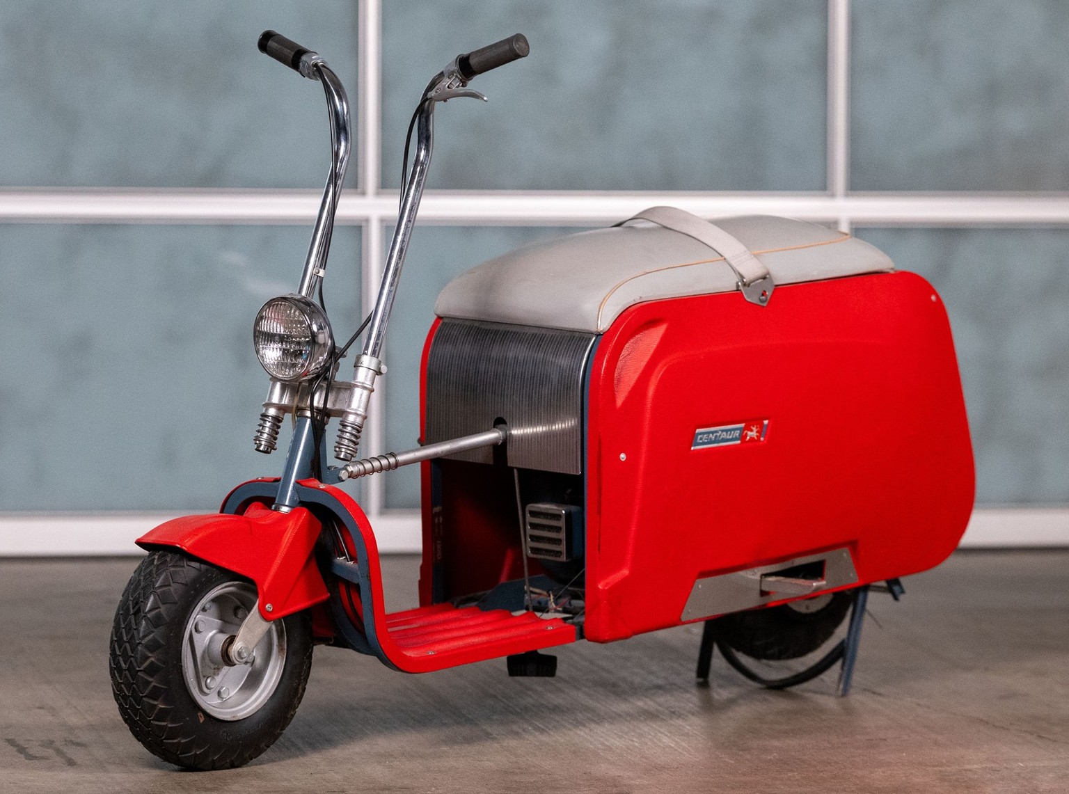 1965 Centaur Portable Scooter

5.76 ci Clinton E65CW 2-Cycle Air-Cooled Single Cylinder
Reed Valve Induction
4.7bhp
Hoover Dri-Draulic Torque Converter
Coil-Over Shocks
Two-Wheel Mechanical Drum Brake ...
