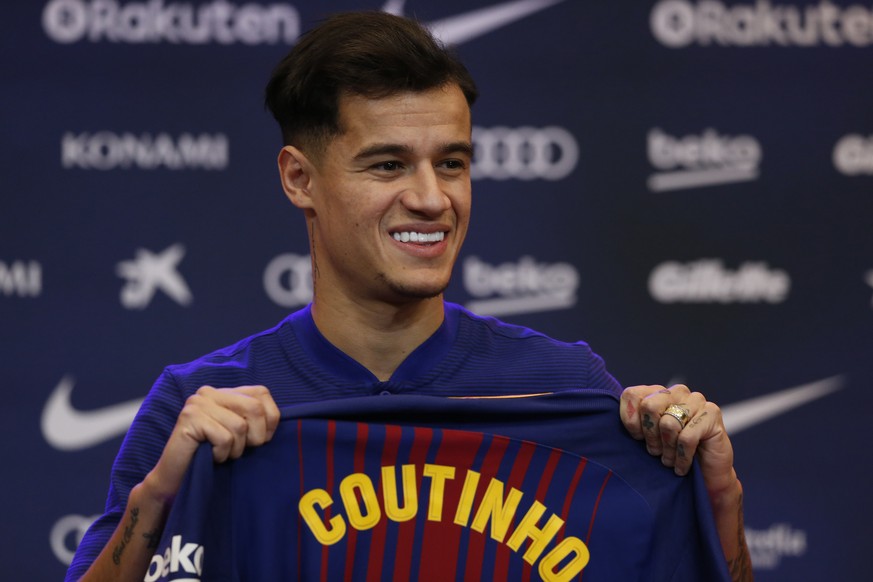 Barcelona&#039;s new signing Brazilian Philippe Coutinho poses for the media, during his official presentation at the Camp Nou stadium in Barcelona, Spain, Monday, Jan. 8, 2018. Coutinho is joining Ba ...