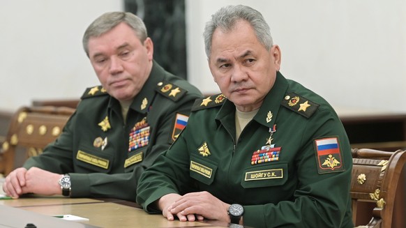 FILE - Russian Defense Minister Sergei Shoigu, right, and Head of the General Staff of the Armed Forces of Russia and First Deputy Defense Minister Valery Gerasimov listen to Russian President Vladimi ...