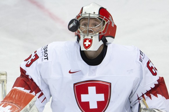 Switzerland&#039;s goaltender Leonardo Genoni looks on the puck, during the IIHF 2021 World Championship preliminary round game between Belarus and Switzerland, at the Olympic Sports Center, in Riga,  ...