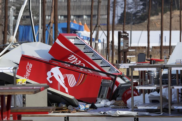 Refrigerators are toppled after they were blown over at a concession stand by gusty winds at the Olympic Park at the 2018 Winter Olympics in Gangneung, South Korea, Wednesday, Feb. 14, 2018. Gusts for ...