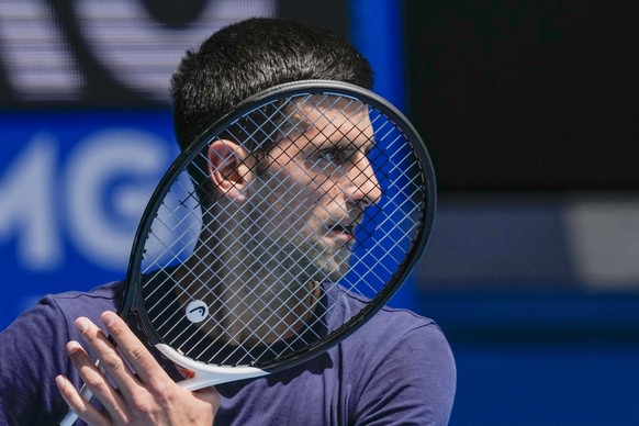 FILE - Defending champion Serbia&#039;s Novak Djokovic practices ahead of the Australian Open tennis championship in Melbourne, Australia, Jan. 12, 2022. Weary after two years of some of the harshest  ...