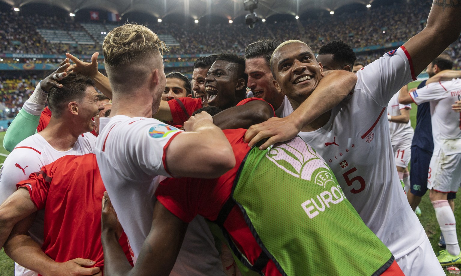 epa09309728 Players of Switzerland celebrate after winning the UEFA EURO 2020 round of 16 soccer match between France and Switzerland in Bucharest, Romania, 28 June 2021. EPA/JEAN-CHRISTOPHE BOTT (RES ...