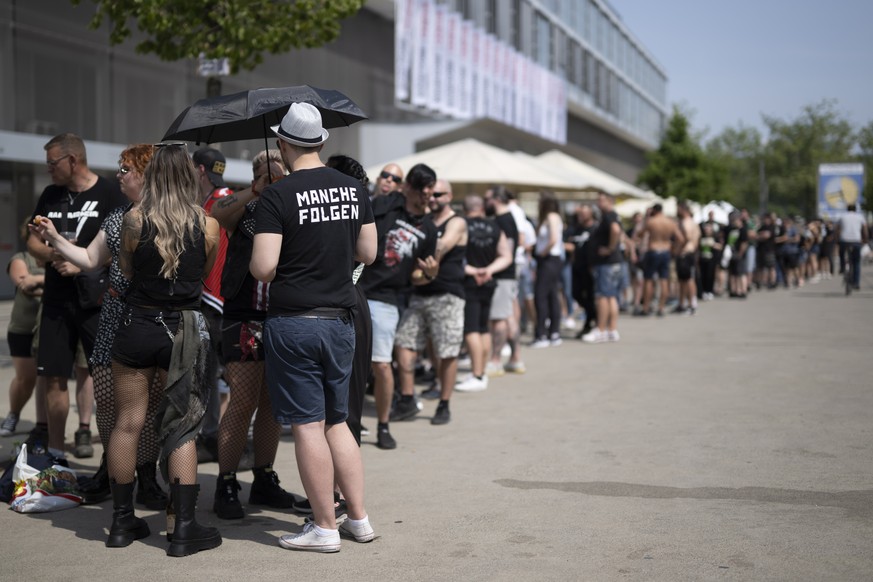 epa10696763 People wait for the doors to open prior to a concert of German band Rammstein at the Wankdorf Stadion in Bern, Switzerland, 17 June 2023. Despite sexual abuse accusations against the band& ...