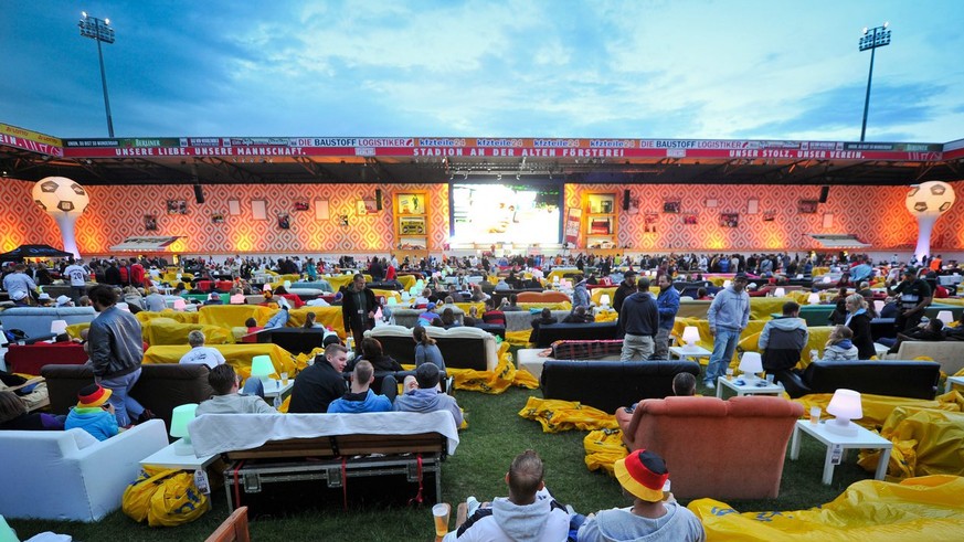 epa04292556 German fans sit on sofas at the Alte Foersterei Stadium, home to German second division team Union Berlin, in Berlin, Germany, 30 June 2014, before the public viewing the Brazil FIFA World ...