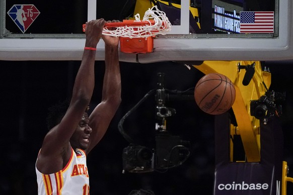 Atlanta Hawks center Clint Capela (15) dunks the ball during the first half of an NBA basketball game against the Los Angeles Lakers in Los Angeles, Friday, Jan. 7, 2022. (AP Photo/Ashley Landis)
