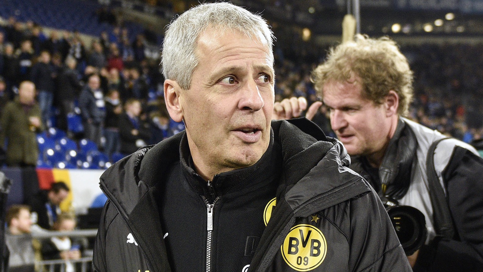 Dortmund coach Lucien Favre waits for the beginning of the German Bundesliga soccer match between FC Schalke 04 and Borussia Dortmund at the Arena in Gelsenkirchen, Germany, Saturday, Dec. 8, 2018. (A ...