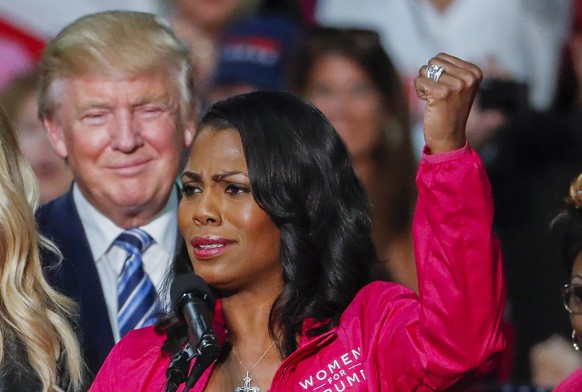 epa06940920 (FILE) - Then US Republican presidential nominee Donald J. Trump (L) participates in a campaign rally with members of the group Women for Trump with Omarosa Manigault (R) in Charlotte, Nor ...