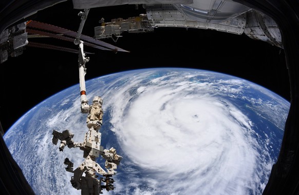 epa09436517 A handout image taken aboard the International Space Station (ISS) and made available by the European Space Agency (ESA) shows Hurricane Ida churning in the Gulf of Mexico ahead of its lan ...