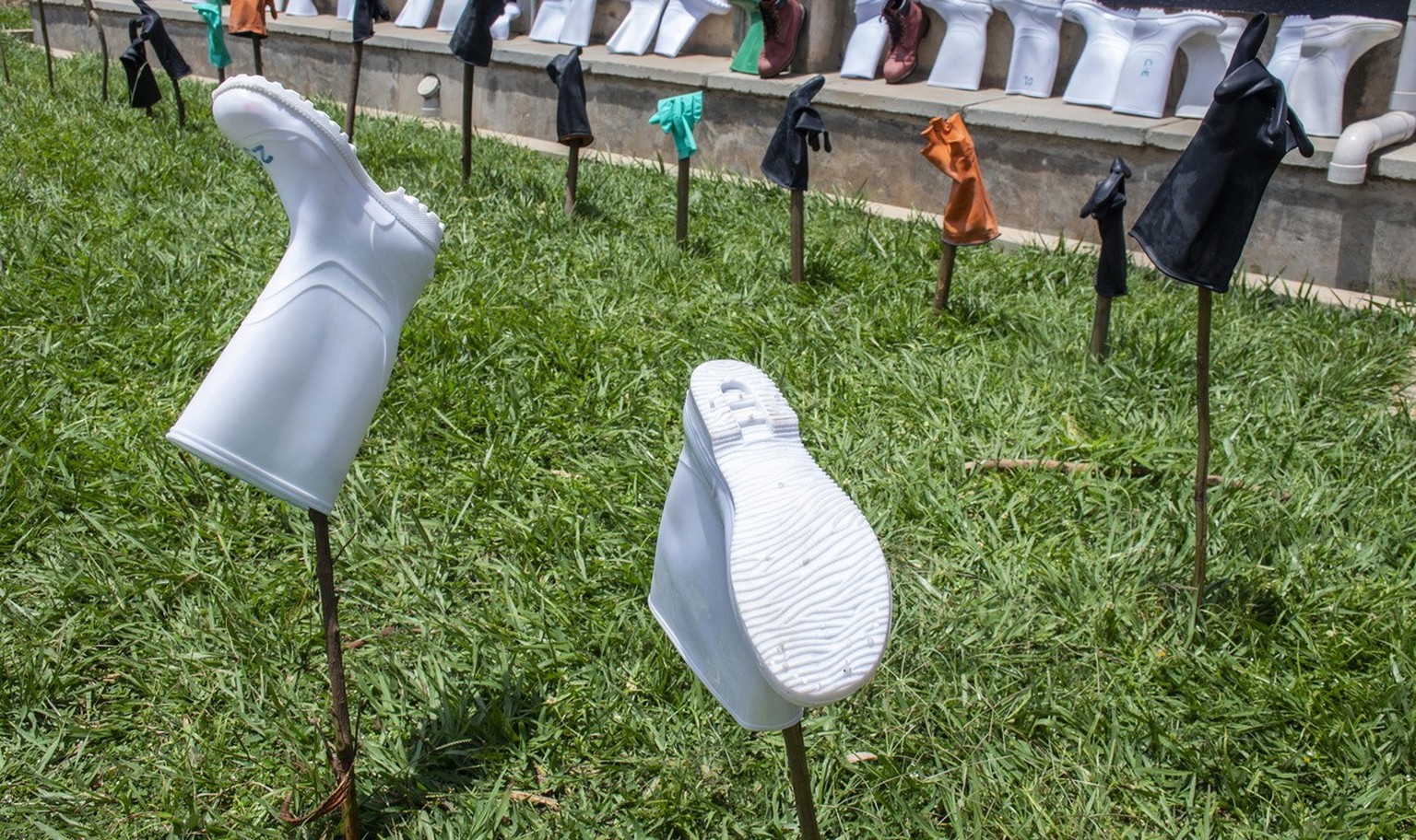epa10255229 Medical boots and gowns at the Entebbe Regional Referral Hospital Isolation Centre in Entebbe, Uganda, 20 october 2022. A total of 64 positive cases and 24 deaths have so far been confirme ...