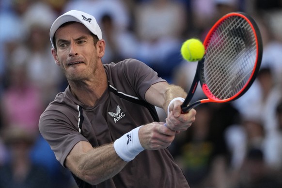 Andy Murray of Britain plays a backhand return to Tomas Martin Etcheverry of Argentina during their first round match at the Australian Open tennis championships at Melbourne Park, Melbourne, Australi ...