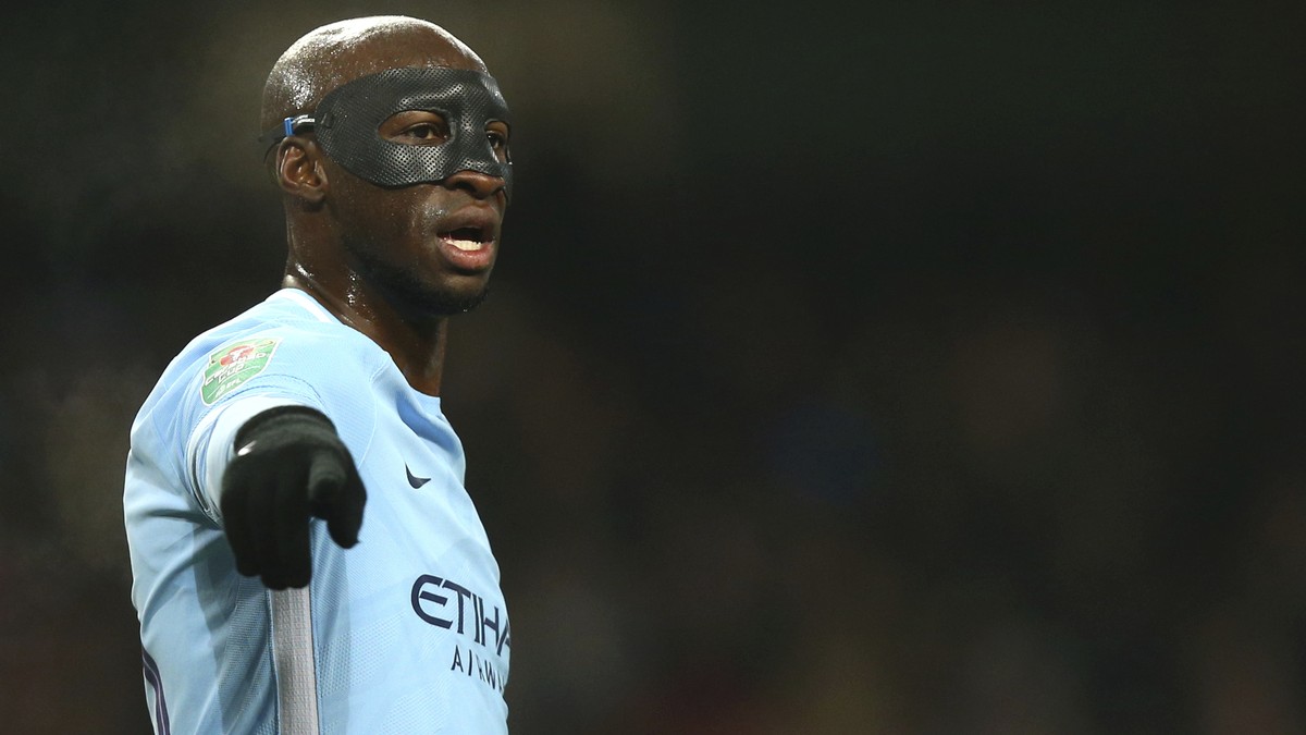 Manchester City's Eliaquim Mangala wears a face protection mask during the English League Cup semifinal first leg soccer match between Manchester City and Bristol City at the Etihad stadium in Ma ...