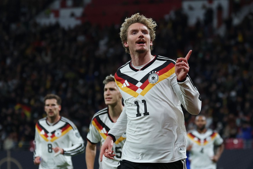 epa12532332 Nick Woltemade of Germany celebrates after scoring the 1-0 during the FIFA World Cup 26 UEFA qualifier between Germany and Slovakia in Leipzig, Germany, 17 November 2025. EPA/FILIP SINGER