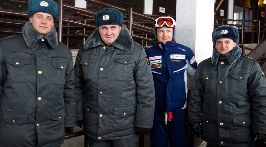 Ambrosi Hoffmann of Switzerland poses with security guards, prior to the second men&#039;s Downhill training for the Alpine Skiing World Cup in Krasnaya Polyana, some 50km from Sochi, Russia, 09 Febru ...