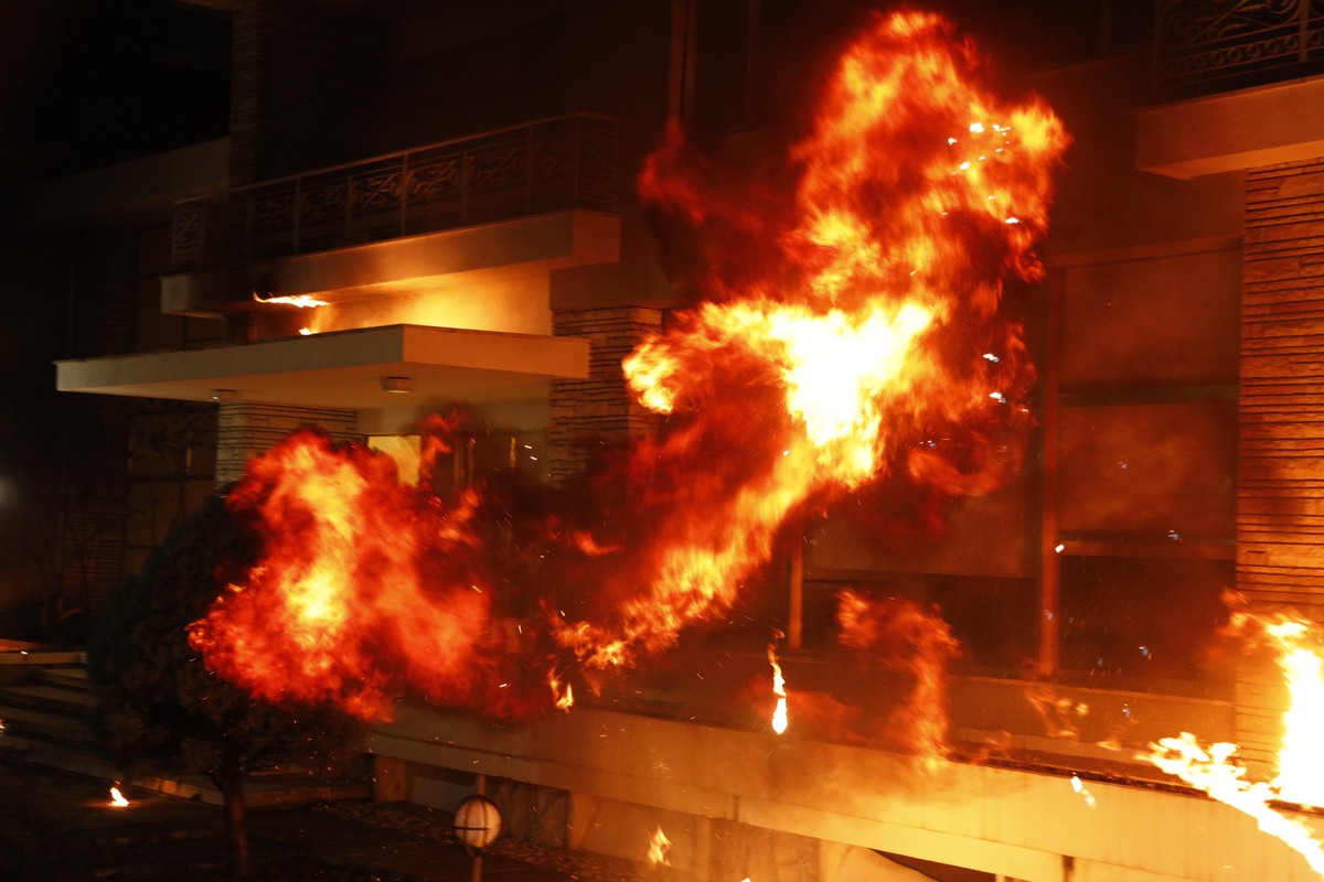 epa12785425 Opposition supporters throw Molotov cocktails at the former residence of the Albanian dictator Enver Hoxha during a protest against the government in Tirana, Albania, 28 February 2026. The ...