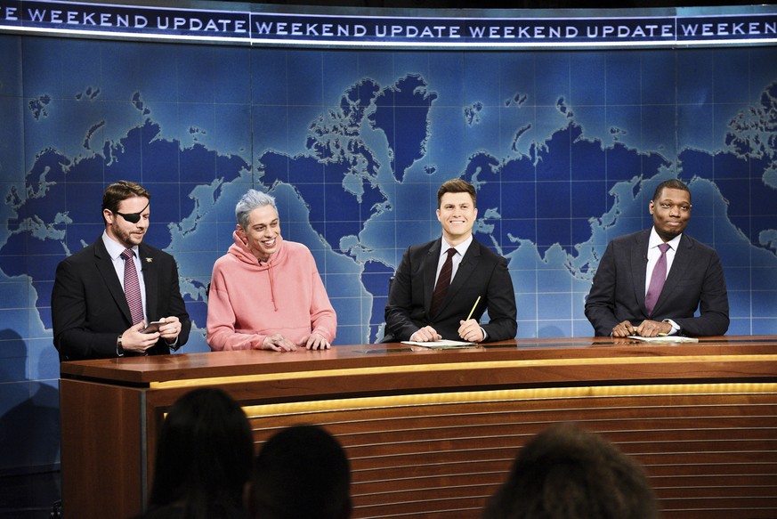 In this Nov. 10, 2018 photo provided by NBC, Lt. Com. Dan Crenshaw, from left, a congressman-elect from Texas, Pete Davidson, Anchor Colin Jost, and Anchor Michael Che appear during Saturday Night Liv ...