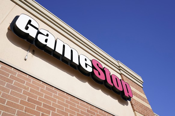 FILE - In this Thursday, Jan. 28, 2021, file photo, a GameStop sign is seen above a store, in Urbandale, Iowa. GameStop says it