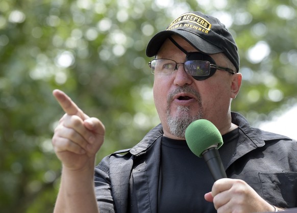 FILE – Stewart Rhodes, founder of the civilian militia group known as the Oath Keepers speaks at a rally outside the White House in Washington, June 25, 2017. Jury deliberations are expected to…
