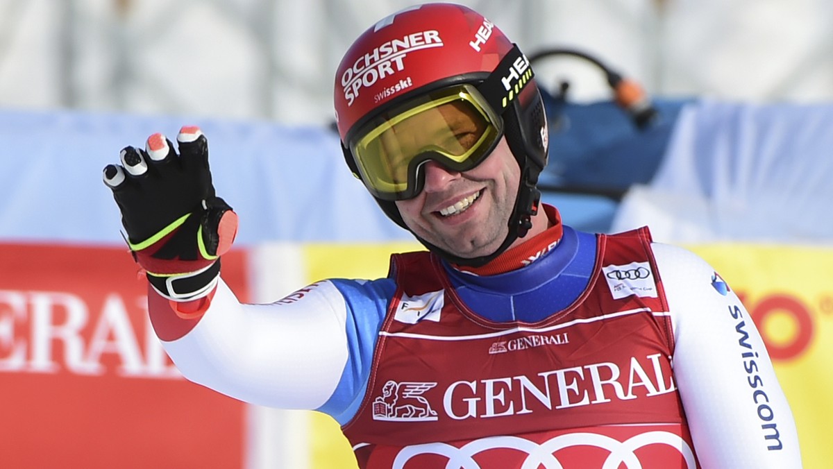 Switzerland's Beat Feuz reacts after completing an alpine ski, men's World Cup downhill, in Garmisch-Partenkirchen, Germany, Friday, Feb. 5, 2021. (AP Photo/Marco Tacca)