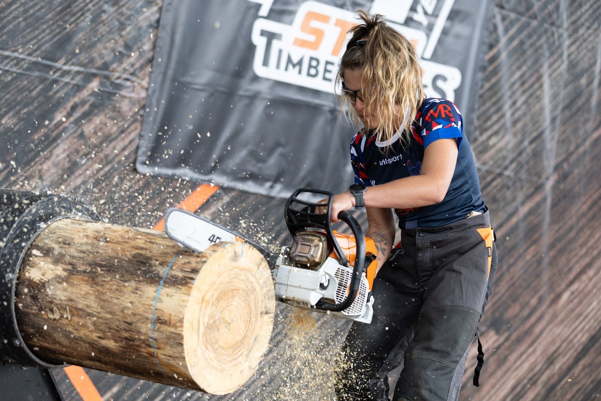 A timbersports player competes during the Ladies Cup on the sidelines of the Timbersports French Championship, in Sarrebourg, eastern France, on August 3, 2025. (Photo by ROMEO BOETZLE / AFP)