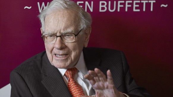 FILE - Warren Buffett, Chairman and CEO of Berkshire Hathaway, speaks during a game of bridge after the annual Berkshire Hathaway shareholders meeting in Omaha, Neb., on May 5, 2019. A recent report f ...