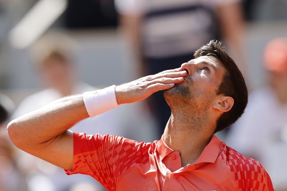 Serbia&#039;s Novak Djokovic celebrates after winning the first round match of the French Open tennis tournament against Aleksandar Kovacevic of the U.S. in three sets, 6-3, 6-2, 7-6 (7), at the Rolan ...