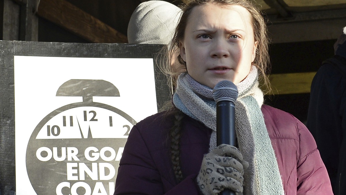 Swedish young activist, 15-year-old Greta Thunberg, right, speaks to climate activists during the March for Climate in a protest against global warming in Katowice, Poland, Saturday, Dec. 8, 2018, as ...