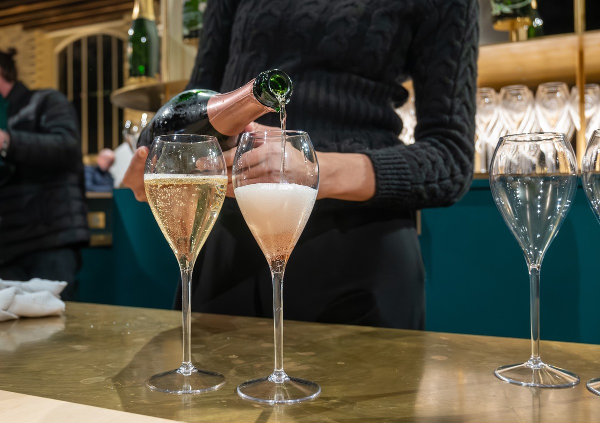 Pouring and tasting of sparkling wine champagne on winter weekend festival in December on Avenue de Champagne, Epernay, Champagne region, France Model Released Property Released xkwx alcohol anniversa ...
