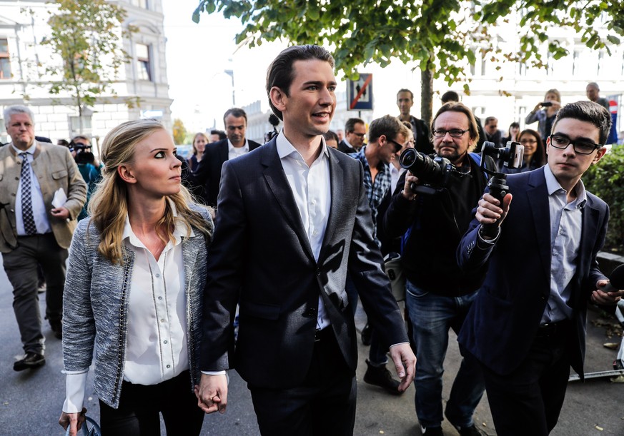 epa06266927 Austrian Foreign Minister Sebastian Kurz (R), the leader and top candidate of the Austrian Peoples Party (OeVP) and his girlfriend Susanne Thier (L) arrive at a polling station during the  ...