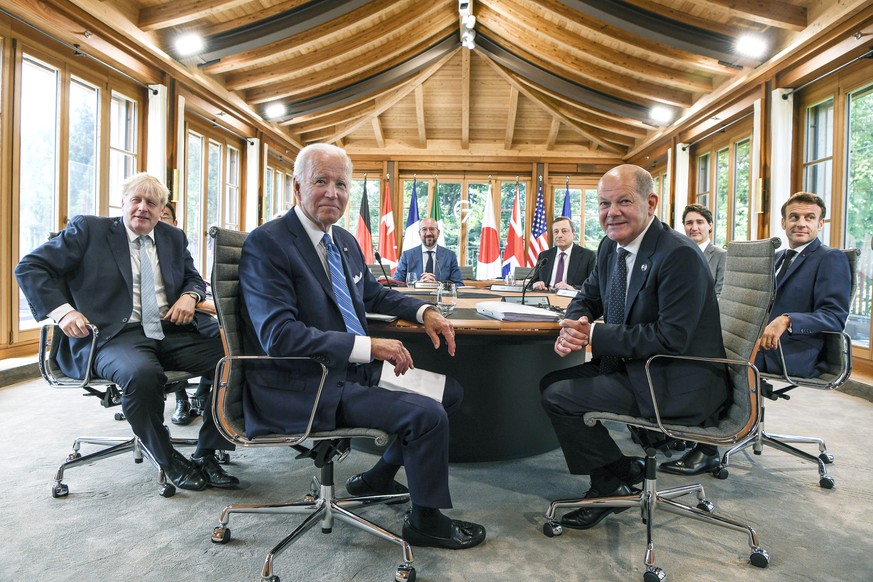 U.S. President Joe Biden, center, attends a working lunch with other G7 leaders to discuss shaping the global economy. Clockwise from left, Fumio Kishida (covered), Prime Minister of Japan, Ursula von ...