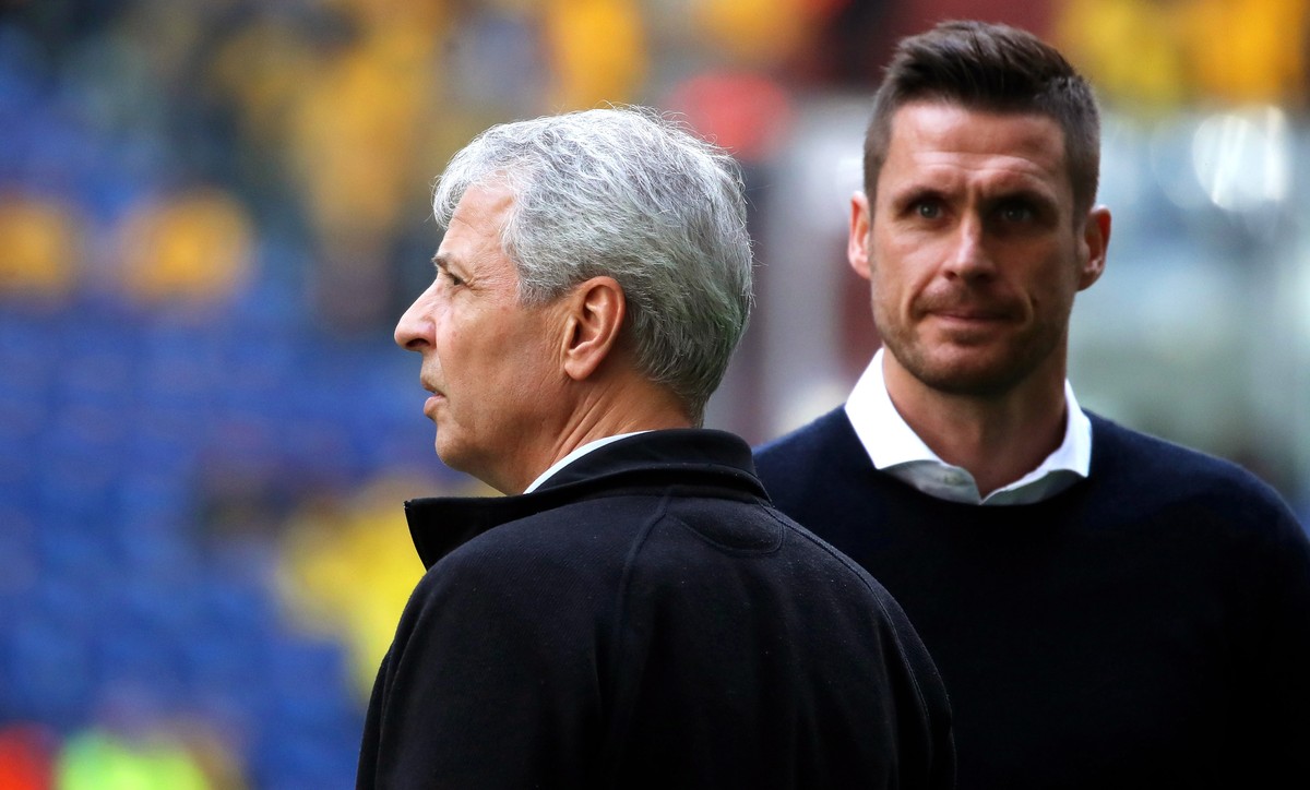 epa07950977 Dortmund's head coach Lucien Favre (L) and Dortmund's head of the licensing player department, Sebastian Kehl (R) arrive for the German Bundesliga soccer match between FC Schalke ...