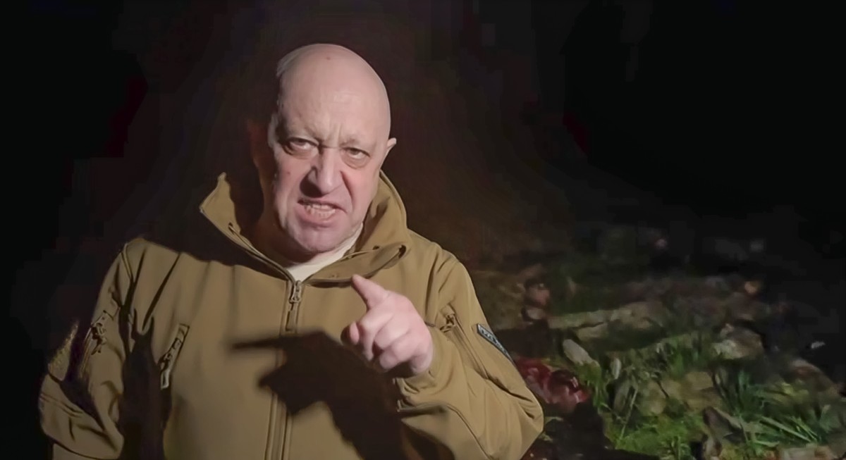 In this handout image taken from a video released by Prigozhin Press Service on Friday, May 5, 2023, head of Wagner Group Yevgeny Prigozhin stands in front of multiple bodies lying on the ground in an ...