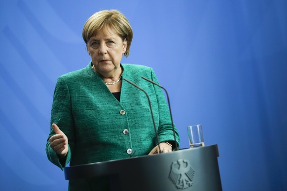 German Chancellor Angela Merkel addresses the media during a joint press conference after a meeting with the President of Angola, Joao Lourenco, at the chancellery in Berlin, Wednesday, Aug. 22, 2018. ...