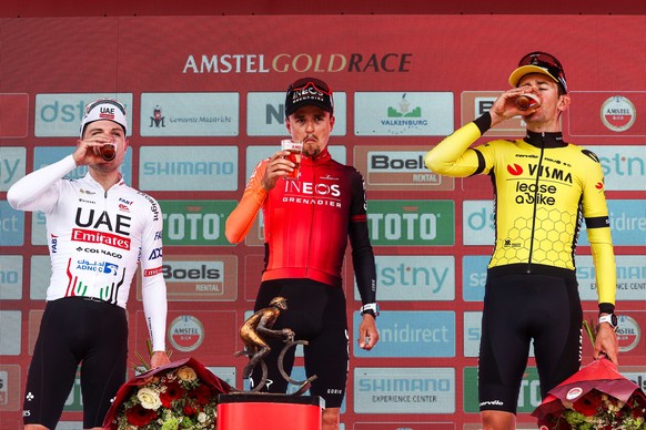 epa11278459 (L-R) Second placed Swiss rider Marc Hirschi of UAE Team Emirates, winner British rider Thomas Pidcock of INEOS Grenadier, and third placed Belgian rider Tiesj Benoot of Team Visma Lease a ...