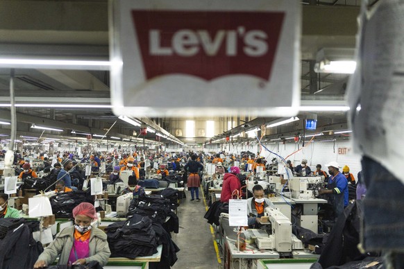 epa12022240 Workers at the Nien Hsing International Garment&#039;s Factory produce Levi jeans for the US market in Maseru, Lesotho, 10 April 2025. The mountain kingdom of Lesotho was initially subject ...