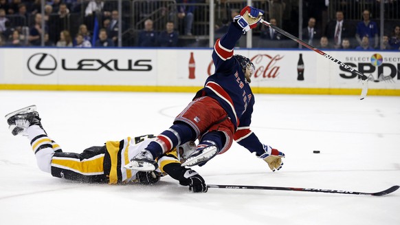 Mar 31, 2017; New York, NY, USA; New York Rangers right wing Rick Nash (61) is tripped by Pittsburgh Penguins defenseman Mark Streit (32) during the second period at Madison Square Garden. Mandatory C ...