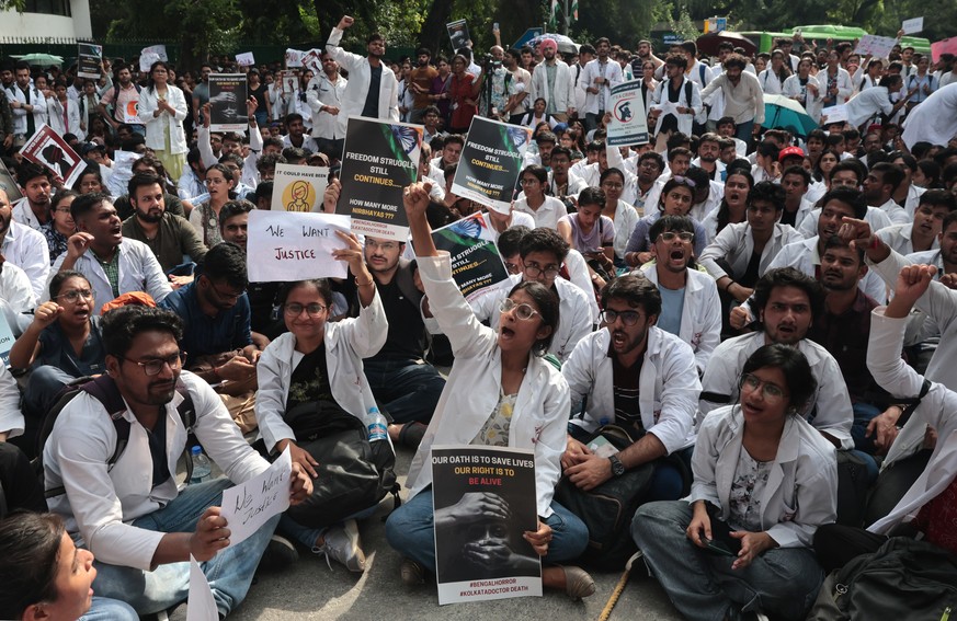 epa11551475 Doctors take part in a protest march against an alleged rape and murder incident at RG Kar medical college in Kolkata, outside Ministry of Health and Family Welfare in New Delhi, India, 16 ...