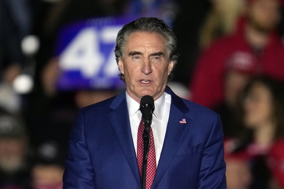 North Dakota Gov. Doug Burgum speaks before Republican presidential nominee former President Donald Trump at a campaign event Friday, Oct. 25, 2024, in Traverse City, Mich. (AP Photo/Paul Sancya)