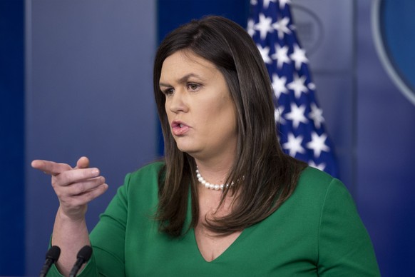 epa06951725 White House Press Secretary Sarah Huckabee Sanders takes a question during a news conference in the James Brady Press Briefing Room of the White House in Washington, DC, USA, 15 August 201 ...