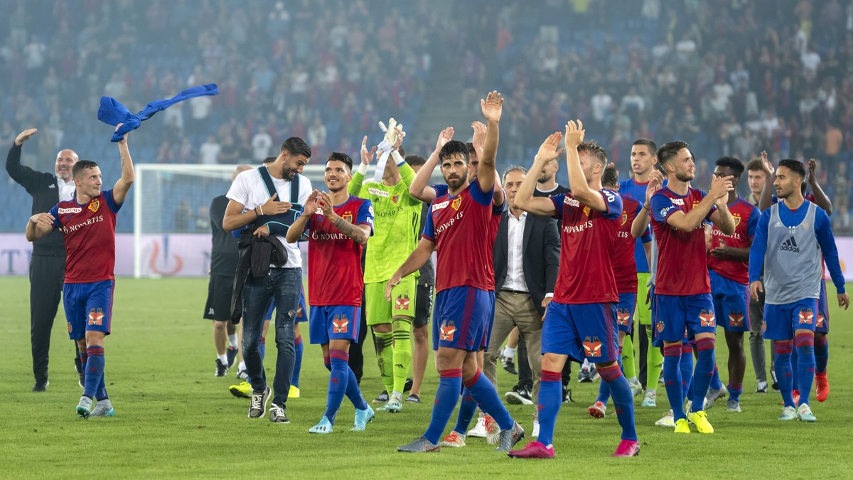 Basel's players cheer after winning the UEFA Champions League second qualifying round second leg match between Switzerland's FC Basel 1893 and Netherland's PSV Eindhoven in the St. Jako ...
