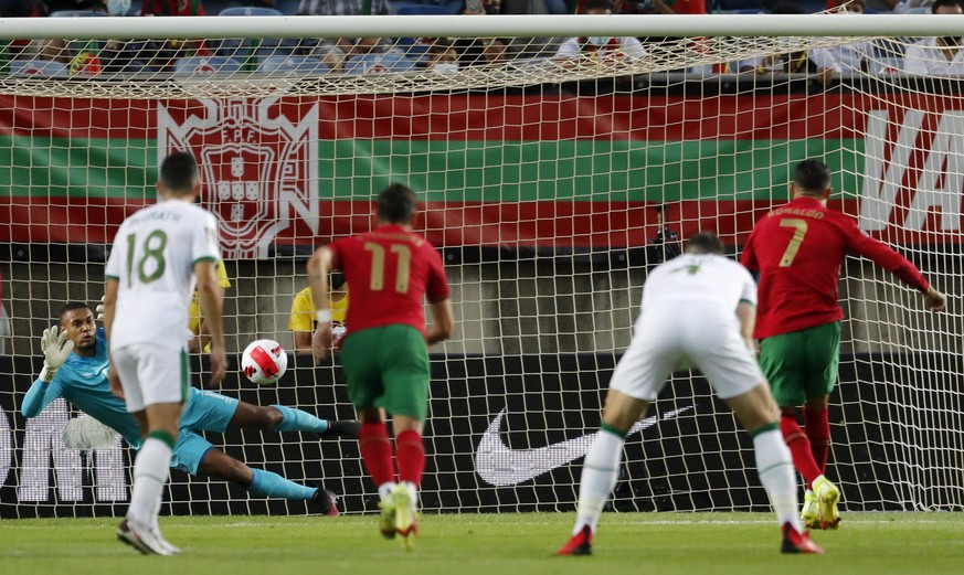 Ireland goalkeeper Gavin Bazunu saves a penalty from Portugal&#039;s Cristiano Ronaldo during the World Cup 2022 group A qualifying soccer match between Portugal and the Republic of Ireland at the Alg ...