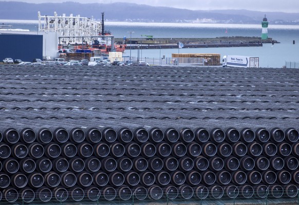 FILE - Pipes for the construction of the Nord Stream 2 natural gas pipeline from Russia to Germany and the Baltic Pipe from Denmark to Poland are stored at the port of Mukran in Sassnitz on the island ...