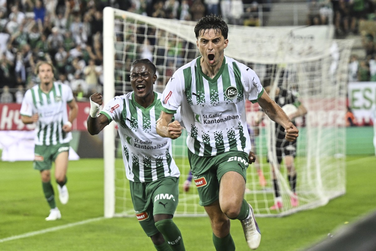 St. Gallen's Albert Vallci, right, and Felix Mambimbi celebrate after Vallci scored their fourth goal during a UEFA Conference League soccer match between Switzerland's FC St. Gallen an Kazh ...