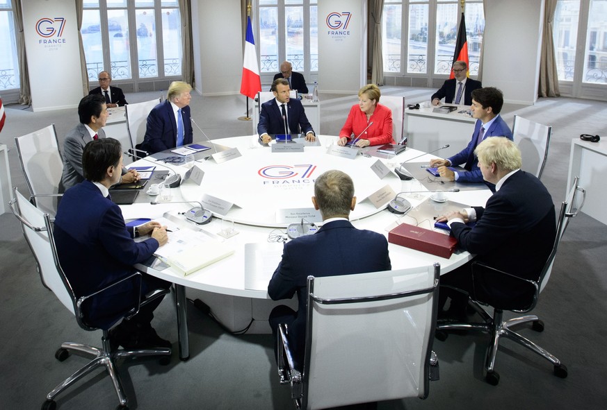 President of the European Council Donald Tusk, clockwise from center front, Italian Prime Minister Giuseppe Conte, Japan Prime Minister Shinzo Abe, U.S. President Donald Trump, President of France Emm ...