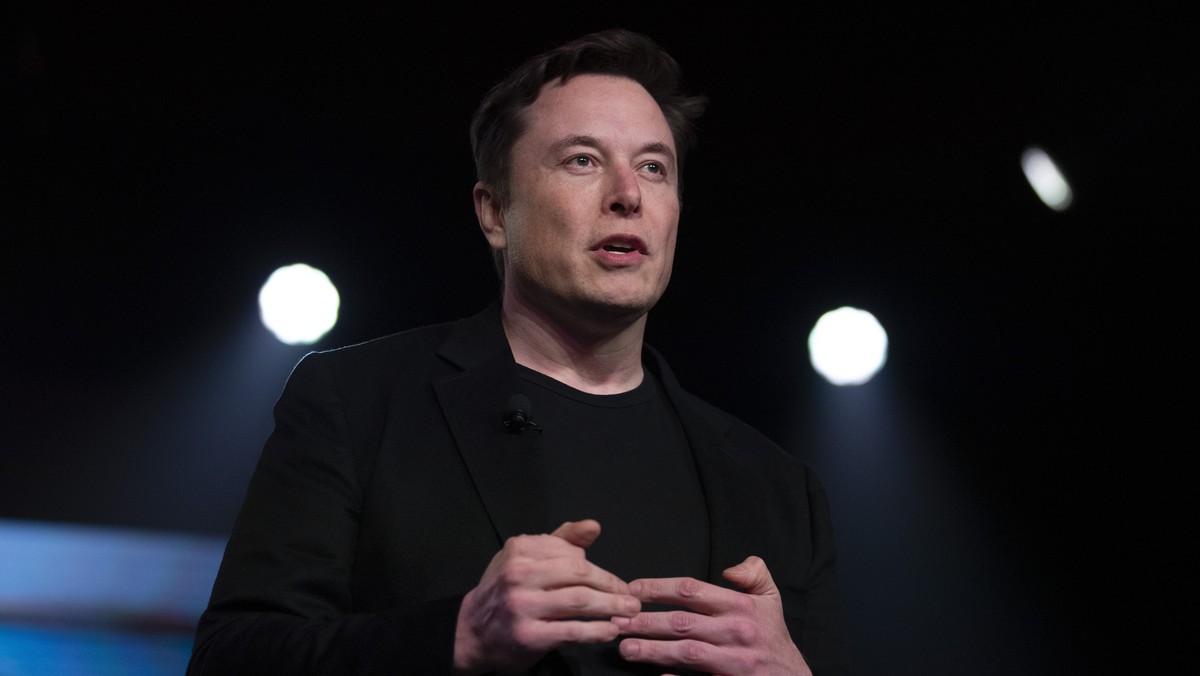 FILE - In this March 14, 2019, file photo, Tesla CEO Elon Musk speaks before unveiling the Model Y at the company's design studio in Hawthorne, Calif. Musk is asking on Twitter whether he should  ...