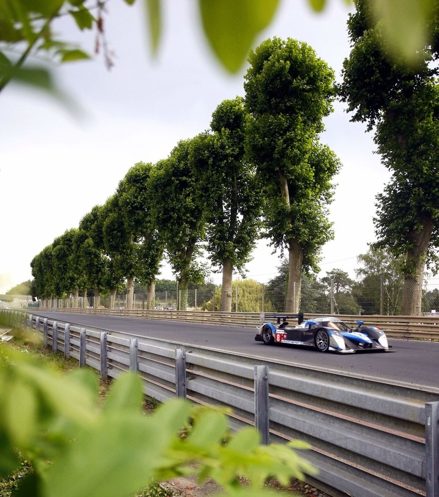 The Peugeot No. 8 driven by Franck Montagny of France with teammates Sebastien Bourdais and Stephane Sarrazin both of France races at daybreak during the 77th Le Mans 24 Hours endurance race, in Le Ma ...